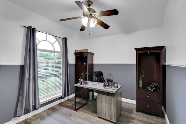 home office featuring a ceiling fan, baseboards, and wood finished floors