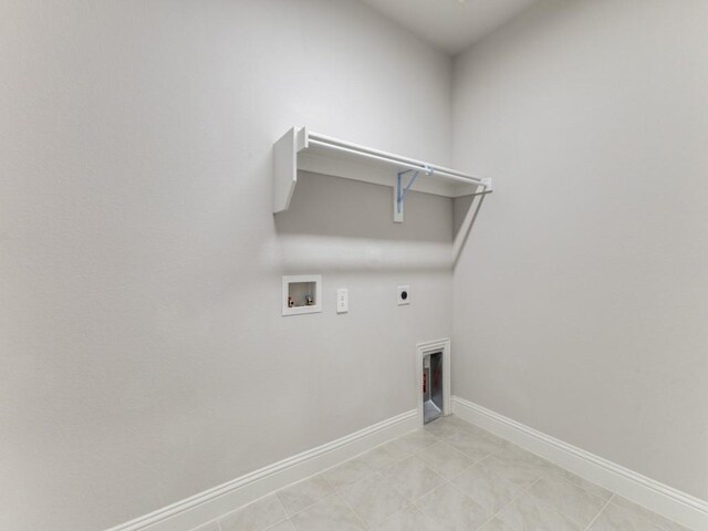laundry area with laundry area, hookup for a washing machine, baseboards, and hookup for an electric dryer