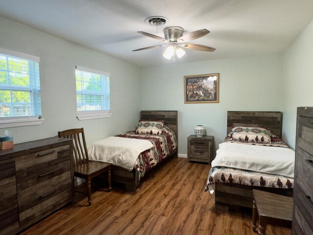 bedroom with ceiling fan and wood finished floors