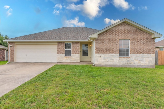 single story home with fence, an attached garage, stone siding, a front yard, and concrete driveway
