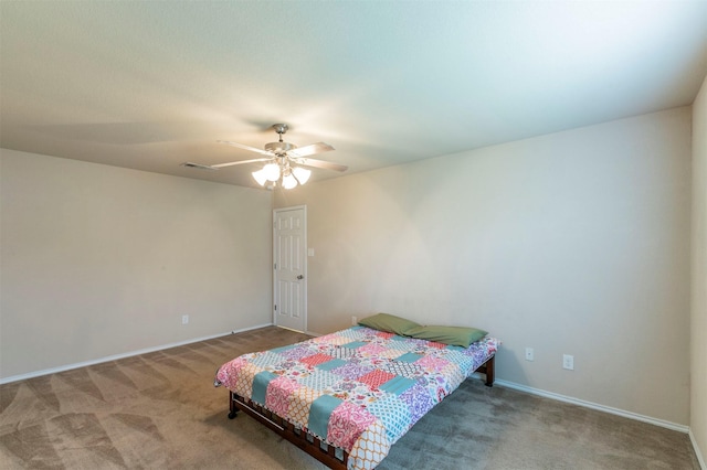 carpeted bedroom featuring baseboards, ceiling fan, and visible vents