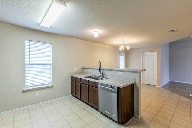 kitchen with visible vents, light countertops, a chandelier, a sink, and dishwasher