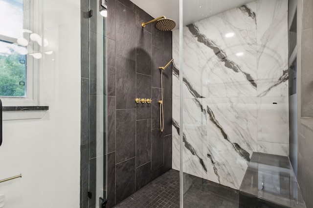 full bathroom with a marble finish shower
