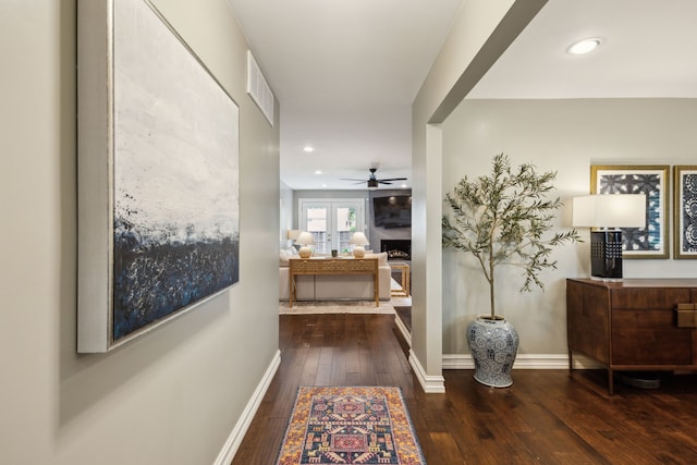 hallway featuring baseboards, french doors, hardwood / wood-style flooring, and visible vents