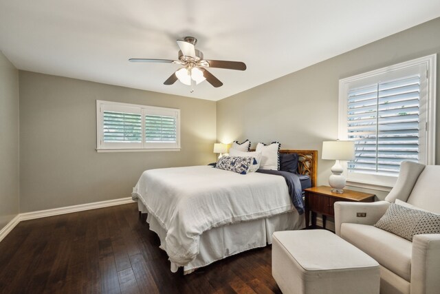 bedroom featuring a ceiling fan, baseboards, and hardwood / wood-style flooring