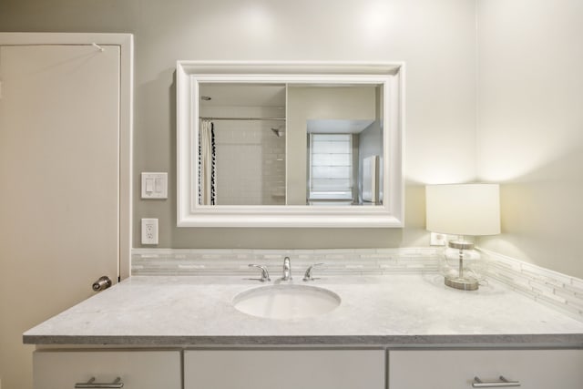 full bathroom featuring vanity and a shower with curtain
