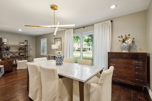 dining room with recessed lighting and dark wood-style floors