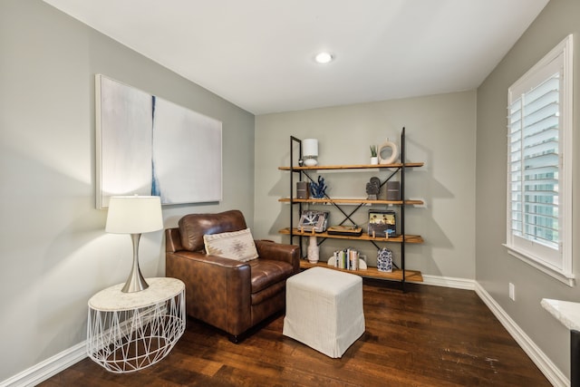 sitting room with baseboards, recessed lighting, and wood finished floors