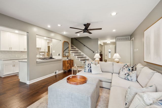 living room with recessed lighting, stairs, dark wood-style floors, and visible vents