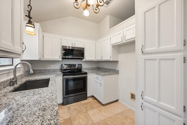 kitchen with white cabinets, appliances with stainless steel finishes, light stone counters, a sink, and a textured ceiling