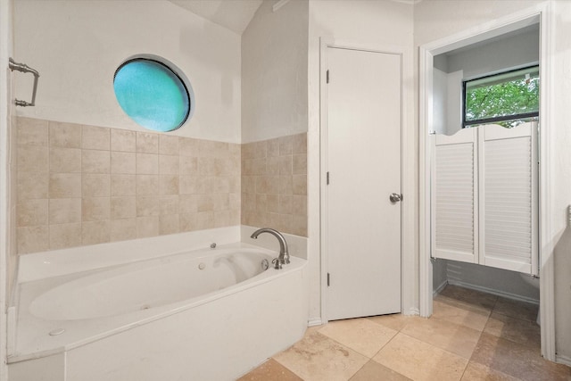 full bathroom with tile patterned floors and a garden tub