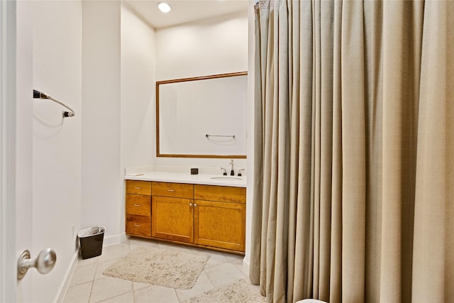 bathroom featuring recessed lighting, tile patterned floors, baseboards, and vanity