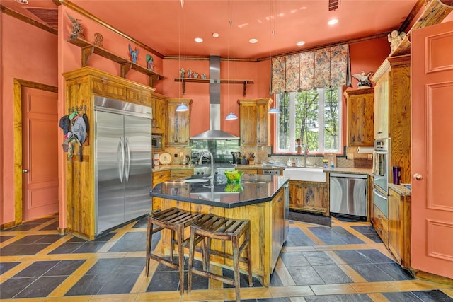 kitchen featuring stainless steel appliances, decorative backsplash, a sink, and a warming drawer