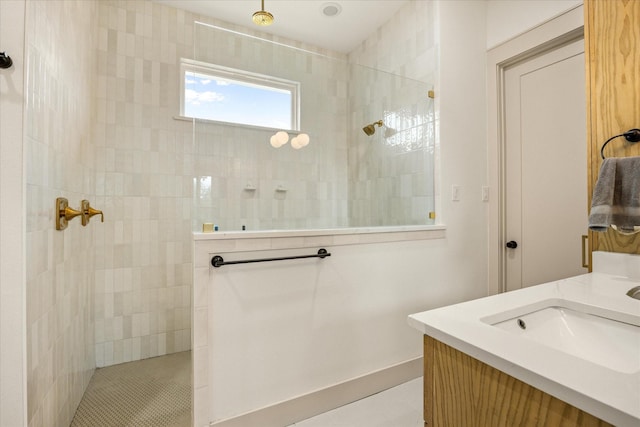 bathroom featuring a walk in shower and a sink