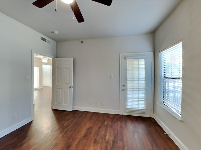 3105 San Jacinto St Unit 108, Dallas, TX 75204 - spare room featuring visible vents, a ceiling fan, baseboards, and dark wood-type flooring