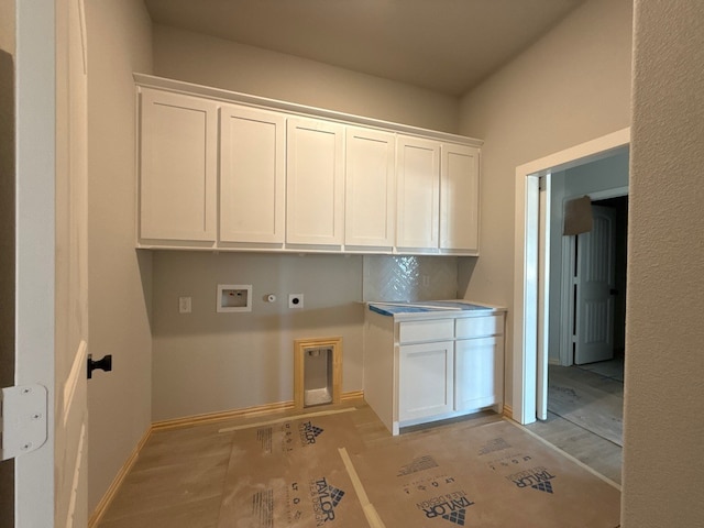 505 Ashlow Ct, Springtown, TX 76082 - laundry area with hookup for an electric dryer, cabinet space, hookup for a gas dryer, washer hookup, and baseboards
