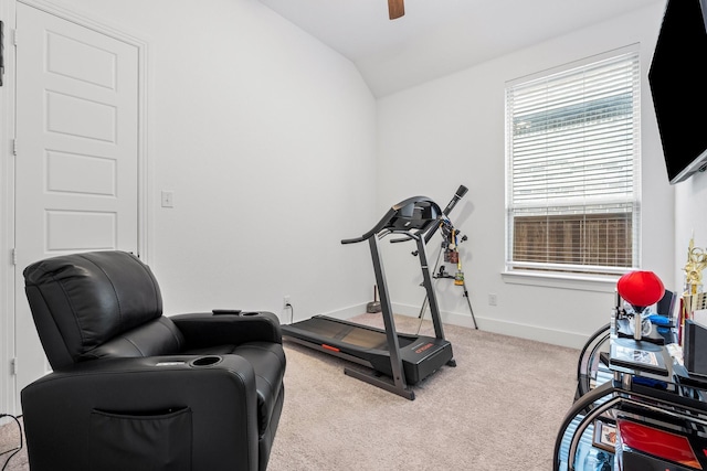 exercise area with carpet flooring, ceiling fan, vaulted ceiling, and baseboards