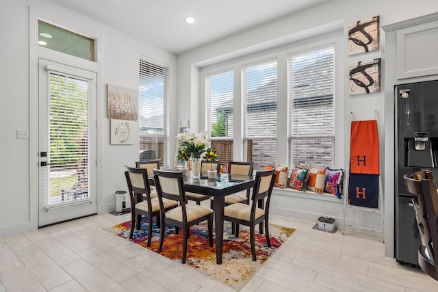 dining area featuring baseboards and recessed lighting