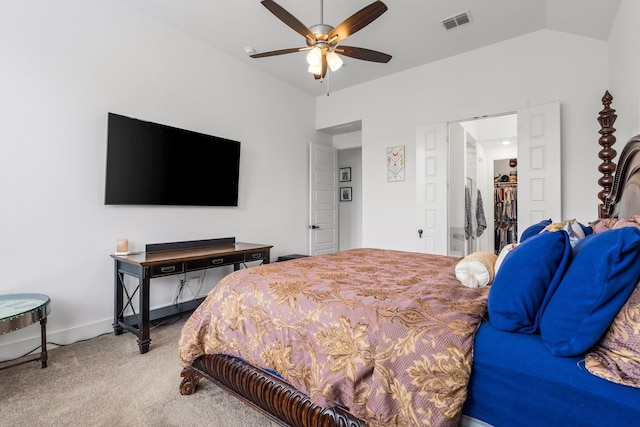 bedroom with a ceiling fan, light colored carpet, visible vents, baseboards, and lofted ceiling
