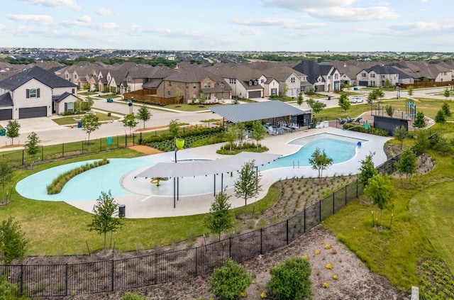 birds eye view of property with a residential view