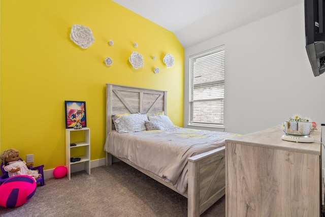 bedroom featuring carpet floors, baseboards, and vaulted ceiling