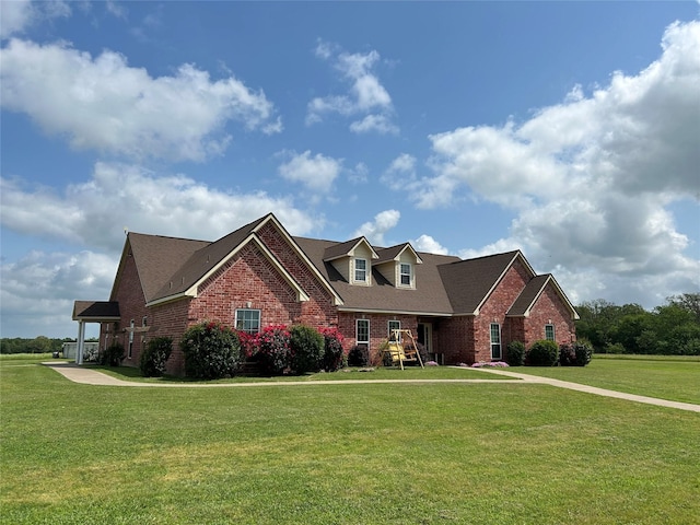 284 County Road 2388, Pickton, TX 75471 - view of front facade featuring brick siding, a shingled roof, and a front lawn