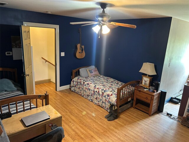 284 County Road 2388, Pickton, TX 75471 - bedroom with a ceiling fan and light wood finished floors