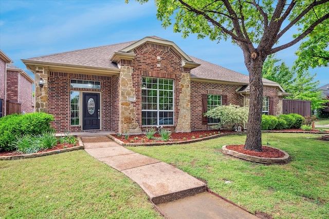 6325 Flagstone Dr, Mckinney, TX 75070 - ranch-style house with a shingled roof, a front yard, and brick siding