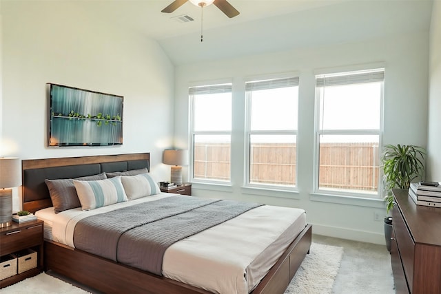 bedroom with ceiling fan, light carpet, baseboards, lofted ceiling, and visible vents