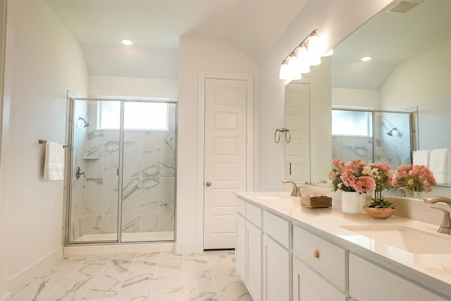 full bathroom with a sink, vaulted ceiling, and a shower stall