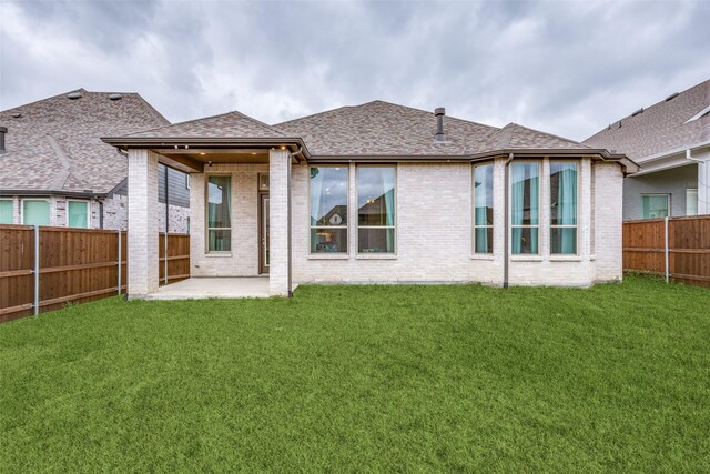 4012 Prickly Pear Ave, Aubrey, TX 76227 - back of house featuring a fenced backyard, a patio, a yard, and brick siding