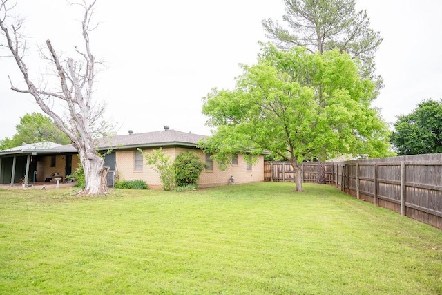 view of yard featuring a fenced backyard