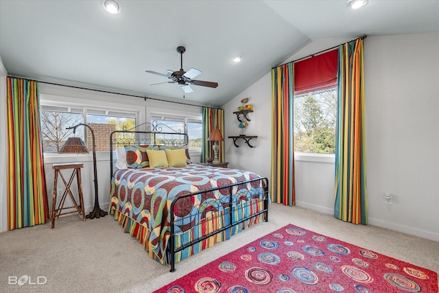 bedroom with recessed lighting, carpet flooring, vaulted ceiling, and multiple windows
