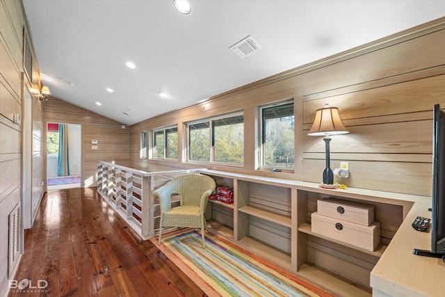 interior space with visible vents, wood-type flooring, wood walls, recessed lighting, and vaulted ceiling