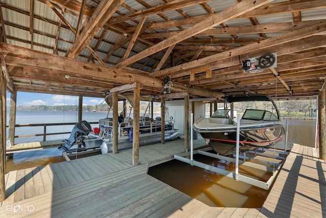 dock area with a water view and boat lift