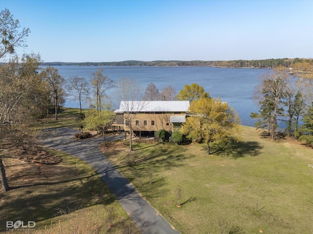 view of dock featuring a yard and a water view
