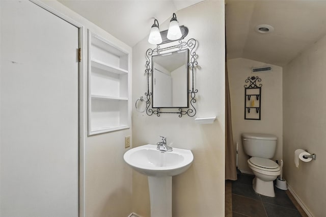 bathroom featuring tile patterned floors, vaulted ceiling, toilet, and visible vents