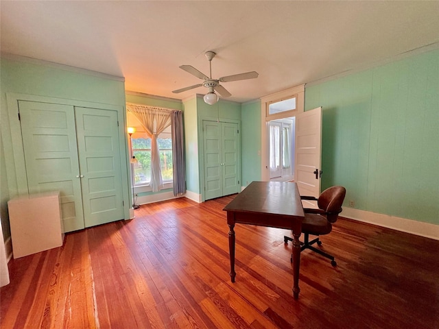 900 Park Dr, Hillsboro, TX 76645 - office area with baseboards, a ceiling fan, wood finished floors, and a wealth of natural light