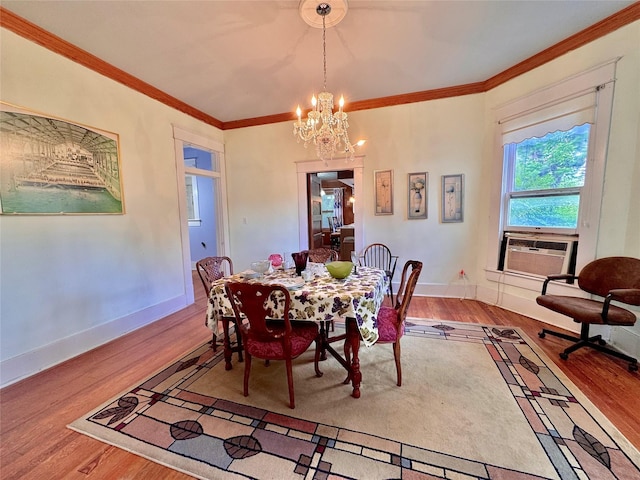 900 Park Dr, Hillsboro, TX 76645 - dining space with ornamental molding, wood finished floors, and a chandelier