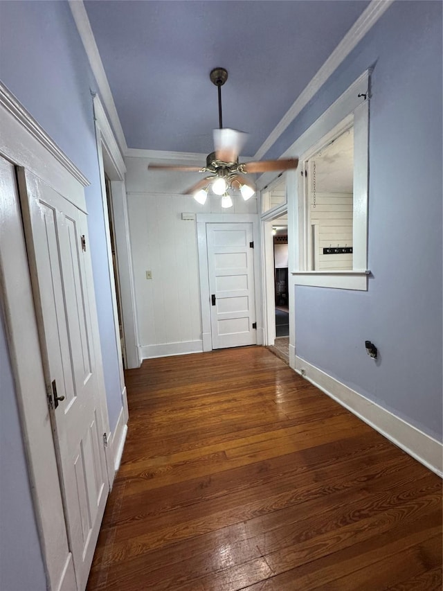 900 Park Dr, Hillsboro, TX 76645 - unfurnished dining area featuring crown molding, baseboards, wood-type flooring, and a ceiling fan