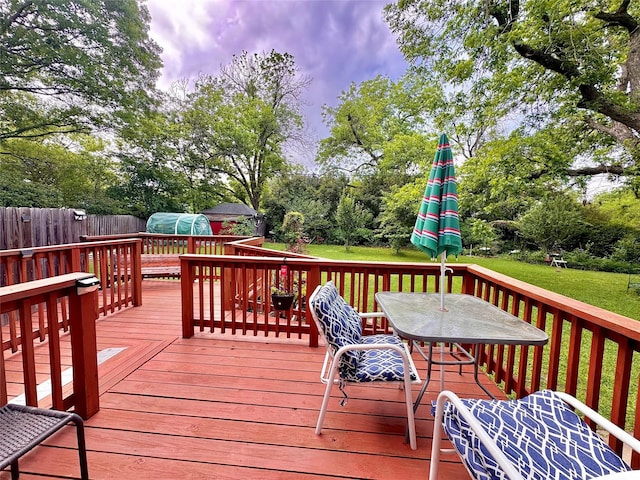 900 Park Dr, Hillsboro, TX 76645 - wooden deck with outdoor dining area, fence, and a yard