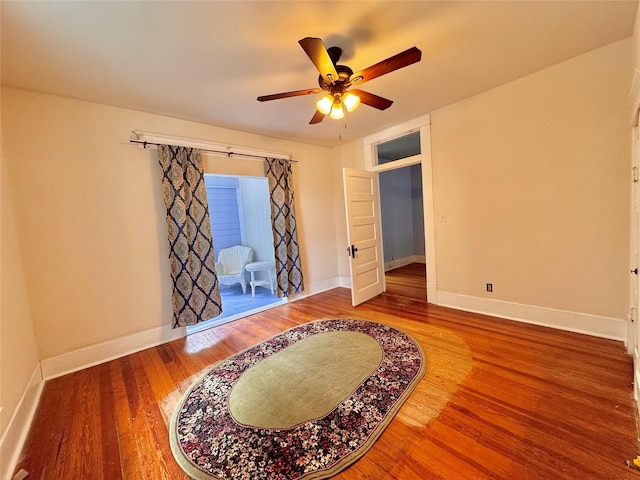 900 Park Dr, Hillsboro, TX 76645 - bedroom with baseboards, a ceiling fan, and wood finished floors