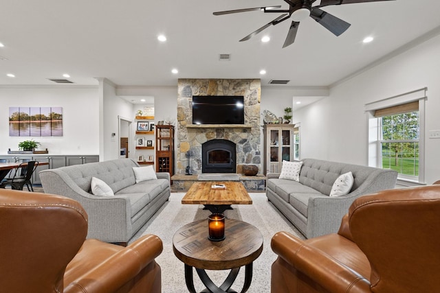 275 Ed Dutton Rd, Pottsboro, TX 75076 - living area featuring a ceiling fan, a stone fireplace, recessed lighting, and ornamental molding