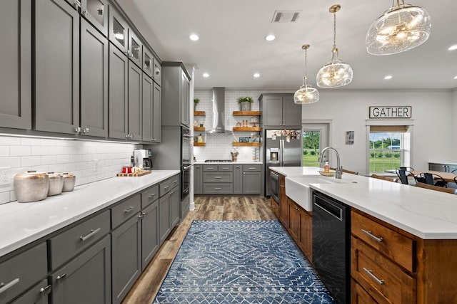 275 Ed Dutton Rd, Pottsboro, TX 75076 - kitchen with black appliances, wall chimney range hood, a sink, open shelves, and wood finished floors