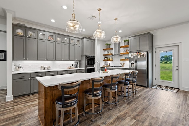 275 Ed Dutton Rd, Pottsboro, TX 75076 - kitchen with stainless steel appliances, gray cabinets, open shelves, dark wood finished floors, and light countertops