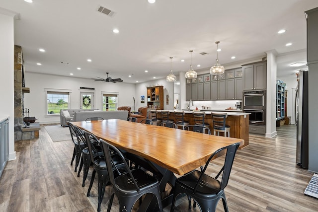 275 Ed Dutton Rd, Pottsboro, TX 75076 - dining space with recessed lighting, ceiling fan, wood finished floors, and a fireplace