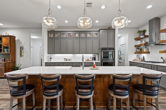 275 Ed Dutton Rd, Pottsboro, TX 75076 - kitchen featuring a sink, wall chimney range hood, stainless steel appliances, gray cabinets, and recessed lighting