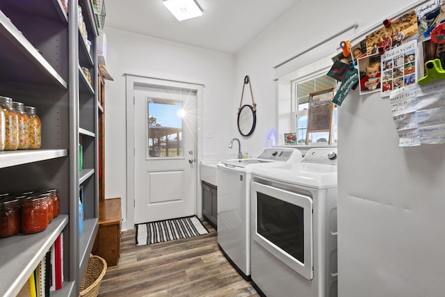 275 Ed Dutton Rd, Pottsboro, TX 75076 - laundry room featuring washer and dryer and wood finished floors