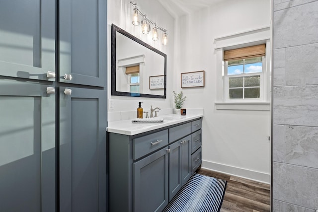 275 Ed Dutton Rd, Pottsboro, TX 75076 - bathroom with baseboards, wood finished floors, and vanity