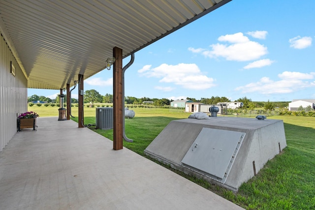 275 Ed Dutton Rd, Pottsboro, TX 75076 - view of storm shelter featuring a yard, central air condition unit, and an outbuilding